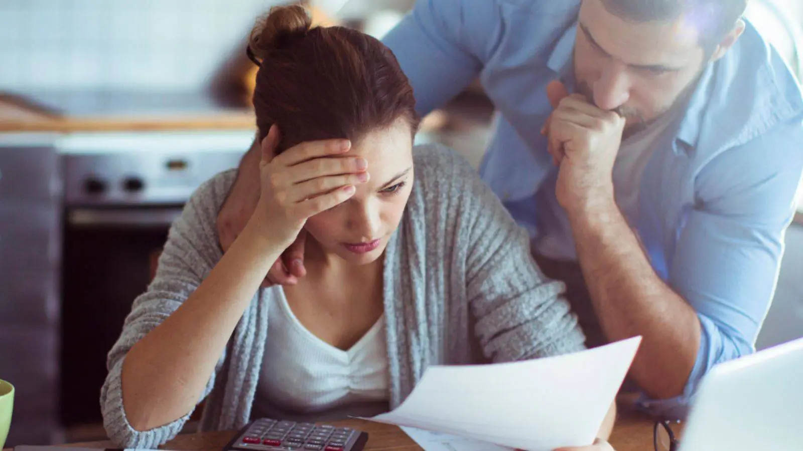 Couple looking at the rising interest rate